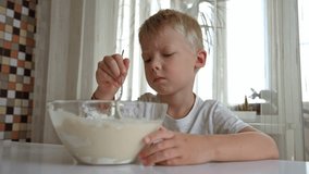 In a bright kitchen, a mother and her young son joyfully prepare pancakes together. They mix ingredients, share smiles, and create delightful memories filled with laughter and love. - Powered by Shutterstock - Get 15% off with code: PIKWIZARD15