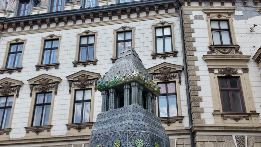 Pécs’ iconic Zsolnay Fountain, showcasing its ornate decorative elements and historic charm