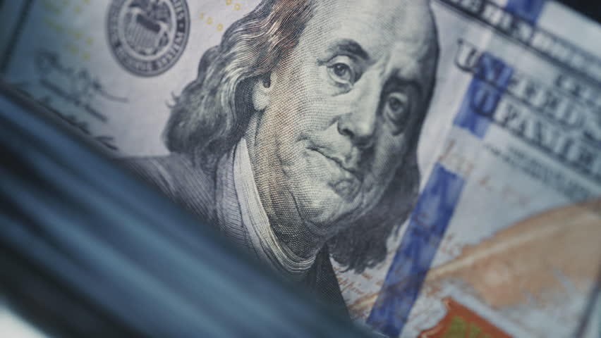 Money cash counting equipment machine. Quick credit or loan, mortgage. Payment and calculation finances. Close-up view of money counter with cash. Banking, investment and currency exchange concept.