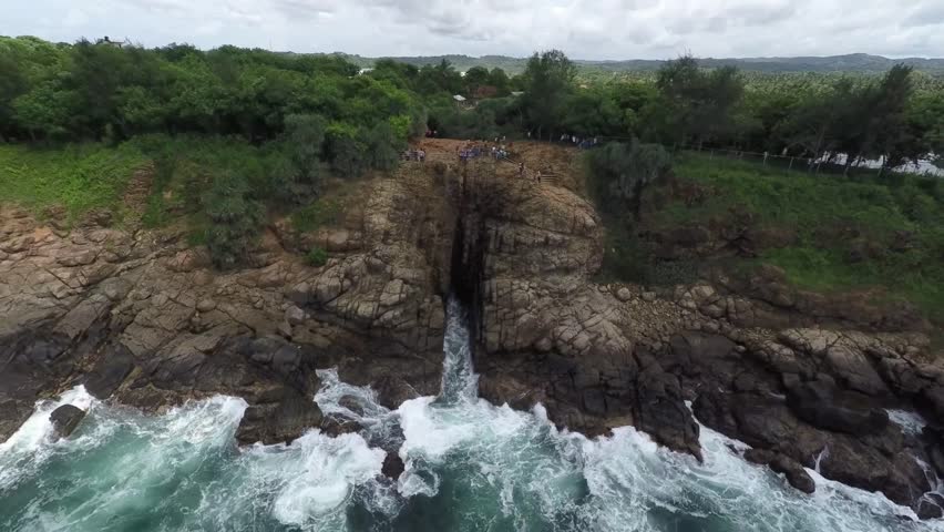The blowhole, Hummanaya, is a magnificent creation of nature, Sri Lanka Kudawella, the second largest  blowhole in the world, the coastline, lava tube-like cracks in the rocks, powerful waves, tourist