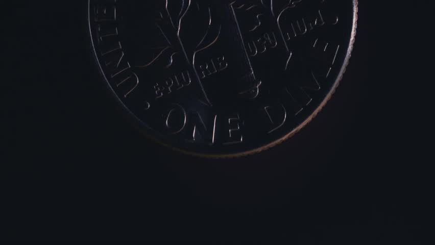 Macro close-up of an American dime coin, showcasing intricate details and metallic texture, ideal for finance, money, and investment visuals.