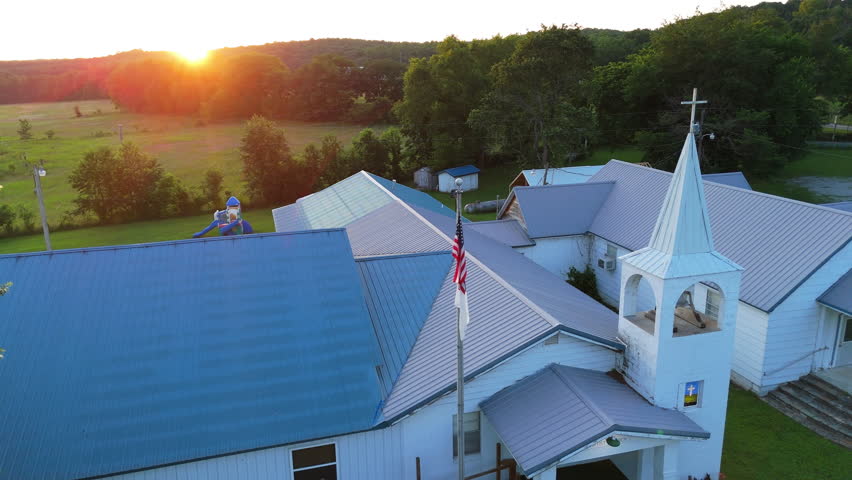 Drone shot rural American church at sunset. Religious community building in Oklahoma
