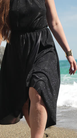 Woman, beach, dress woman walks barefoot sparkling black dress summer vacation vertical video
