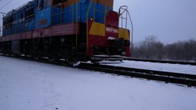 Electric locomotive moving along a snow-covered railway in winter, surrounded by frosty landscape. Concept of rail transport, logistics and cargo transportation in cold season. Suitable for - Powered by Shutterstock - Get 15% off with code: PIKWIZARD15