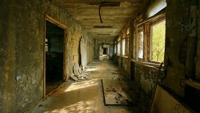 Eerie footage capturing the haunting interior of an abandoned school in Pripyat, Ukraine, a ghost city within the Chernobyl Exclusion Zone. The scene depicts a desolate classroom or corridor, showcasi - Powered by Shutterstock - Get 15% off with code: PIKWIZARD15