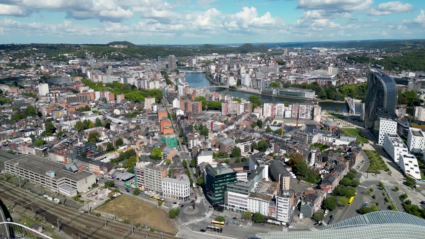 Aerial view of the modern architecture of Liège-Guillemins train station contrasting with the city