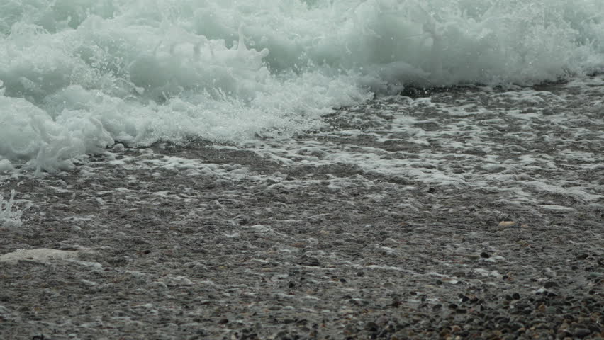 Waves Crashing Shore Coastal Erosion: Beach, Ocean, Stormy weather impacting shoreline during high tide.