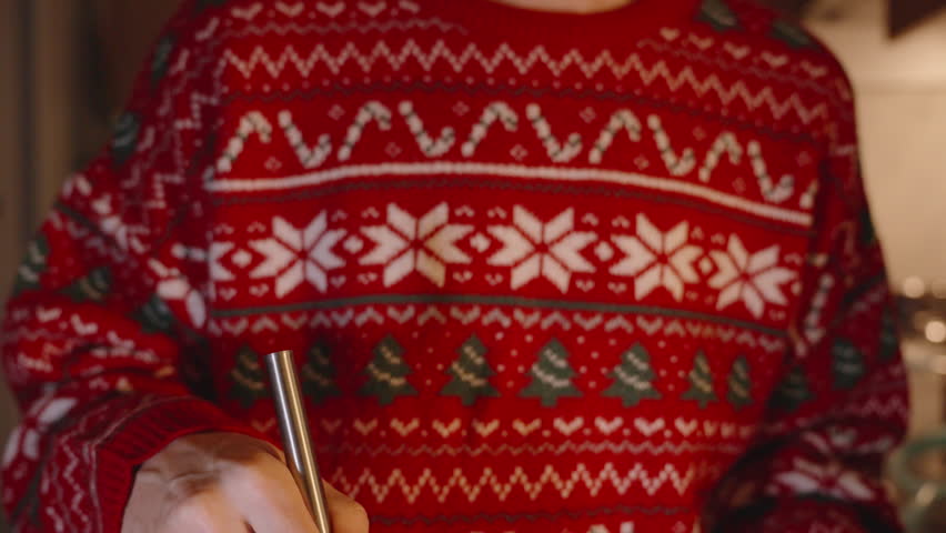 Woman in Red Sweater Adding Butter from Bowl into Glass Mixing Bowl Using Whisk.