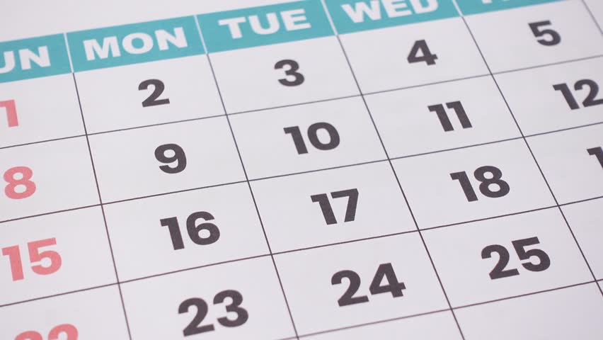 A monthly desk calendar with red crossed dates marked for scheduling, planning, and deadline reminders. Perfect for illustrating time management, productivity, and business organization concepts