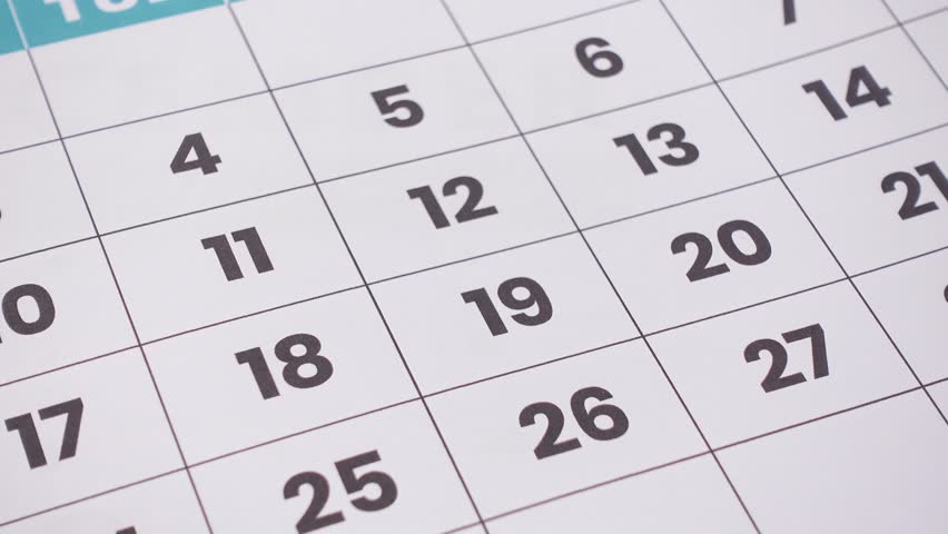 A printed monthly calendar with several dates circled in red, symbolizing important events, deadlines, or reminders. 