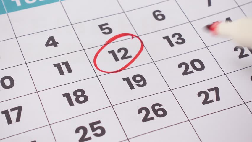 A printed monthly calendar with several dates circled in red, symbolizing important events, deadlines, or reminders. 