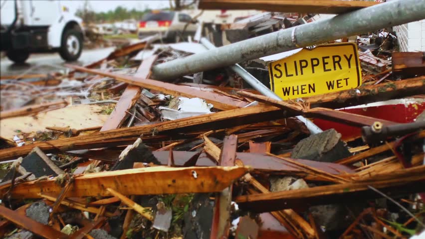 A bent and damaged street sign after a powerful tornado, symbolizing natural disaster impact, destruction, and weather aftermath. Perfect for nature, disaster awareness, and education visuals.