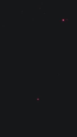 A vertical video animation of a sparkling gold frame on a magical dark purple and blue background perfect for social media stories.