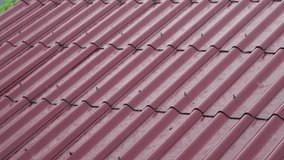 Rain Falling on a Red Corrugated Tiled Roof - Powered by Shutterstock - Get 15% off with code: PIKWIZARD15