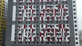 Modern Apartment Building with Red and Gray Geometric Facade in Medan Indonesia - Powered by Shutterstock - Get 15% off with code: PIKWIZARD15