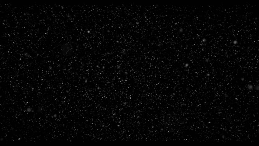 Flying dust particles on a black background