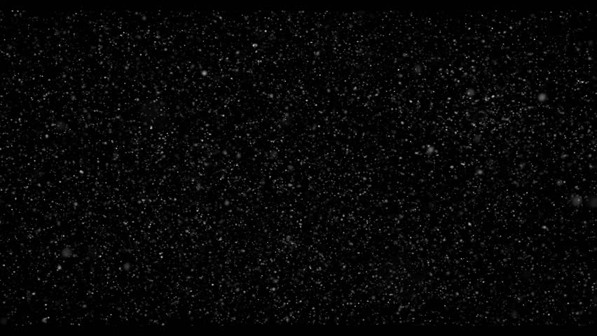 Flying dust particles on a black background