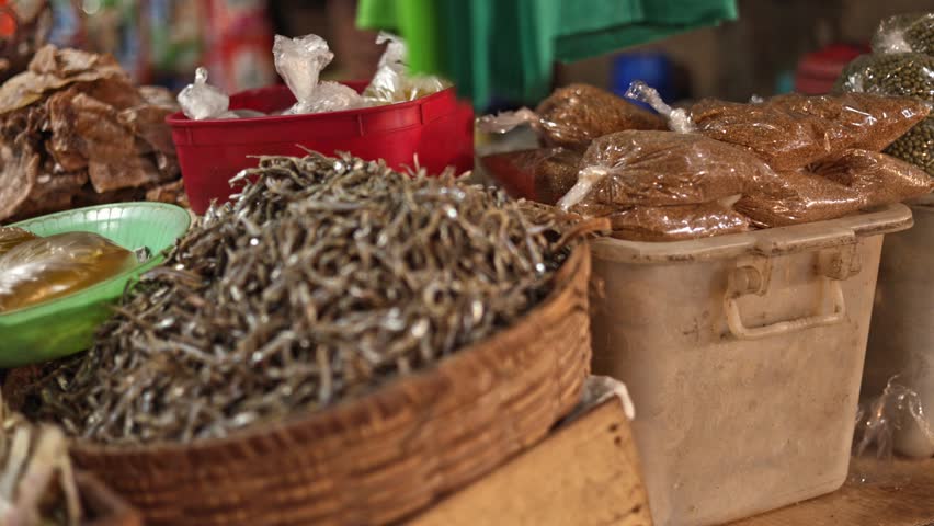 Spicy dried fish selection bold flavor experiments stall, spicy dried fish selection reveals fresh ingredient row with hot basket, colorful exotic scene, selection moment, great for bold flavor reels.