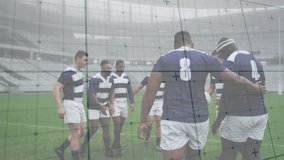 Rugby players linking arms in sports huddle then passing white green ball for pregame motivation. Athletes, teamwork, camaraderie, strategy, competitive, athleticism, stadium - Powered by Shutterstock - Get 15% off with code: PIKWIZARD15
