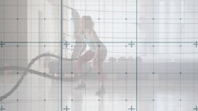 Woman squatting and gripping battle ropes, generating rhythmic U-shaped waves for fitness training. Athletic, strength, power, endurance, workout, functional, dynamic - Powered by Shutterstock - Get 15% off with code: PIKWIZARD15