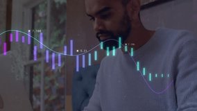 Mid adult man opening laptop showing charts, scrolling smartphone while monitoring financial data. Professional, technology, data visualization, workspace, modern, analysis, digital - Powered by Shutterstock - Get 15% off with code: PIKWIZARD15