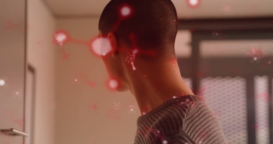 Man standing in room tracking floating red particles circling head showing interactive technology. Ambient, futuristic, minimalistic, contemplative, digital art, atmospheric, ethereal
