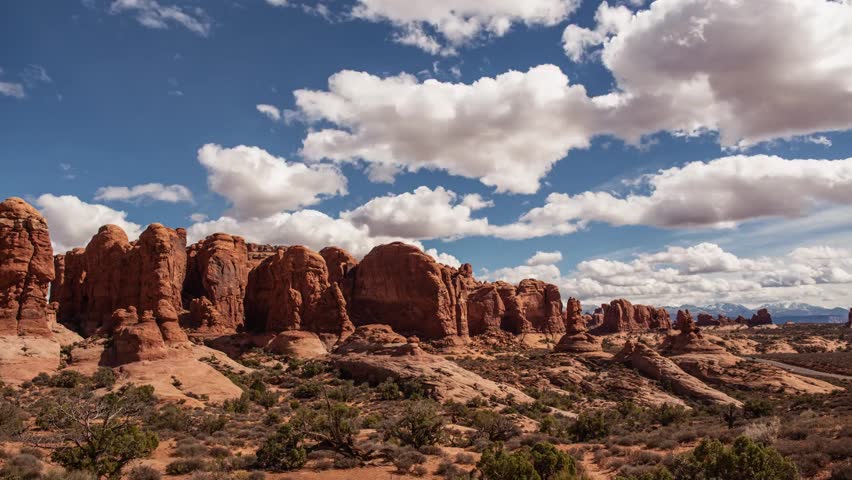 Time-lapse of desert landscape in Arches National Park, showcasing stunning rock formations, changing light, and the vast natural beauty of the area.