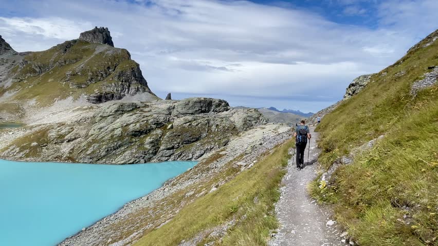 Hiker on 5 Lakes Hike at Pizol, St. Gallen, Switzerland.