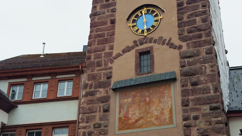 The Historic Clock Tower, meticulously adorned with beautiful Frescoes, is located in the vibrant Town Square area