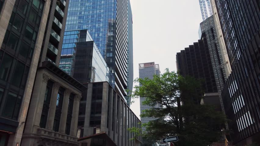 A stroll down Rue Saint-Jacques in Montreal, Quebec, Canada. Tall modern skyscrapers and the city
