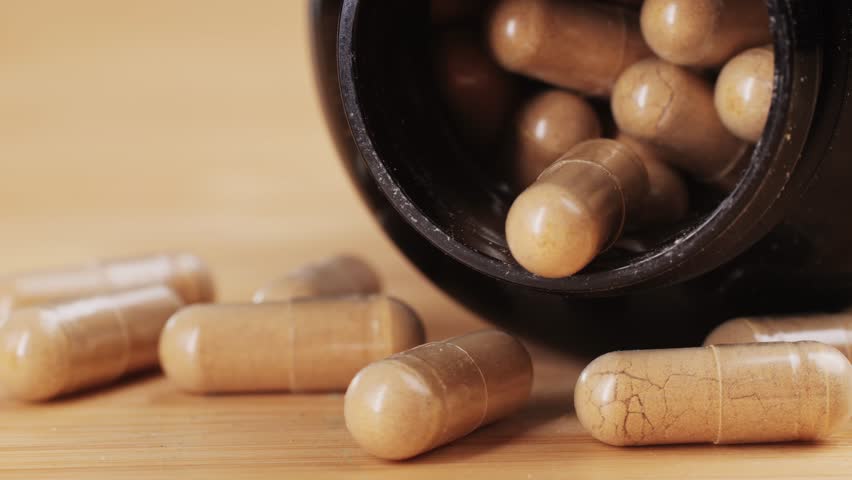 Ashwagandha Indian Ginseng Powder in White Bowl isolated on white background, superfood close up. 