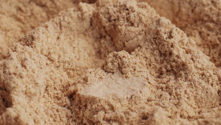 Ashwagandha Indian Ginseng Powder in White Bowl isolated on white background, superfood close up. 
