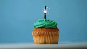 Lighting sparkler atop cupcake shooting sparks as gold confetti drifting down celebrating birthday. Celebration, party, festivity, glamour, glamourous, vibrant, whimsical - Powered by Shutterstock - Get 15% off with code: PIKWIZARD15