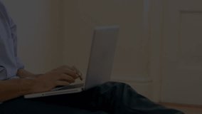 Mid-adult man typing on laptop in technology office, driving holographic globe showing data streams. Futuristic, digital, innovation, connectivity, data visualization, remote work, modern design - Powered by Shutterstock - Get 15% off with code: PIKWIZARD15