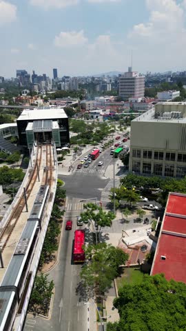 Cinematic top-down view of Line 3 metro train in motion on tracks surrounded by urban area