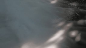 Steam Fog flows over the water in pond and sunlight shines through.  A fine mist that is created by water droplets that shoot out from playground equipment or from steam that rises in water evaporates - Powered by Shutterstock - Get 15% off with code: PIKWIZARD15