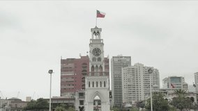 Daytime View of Playa Brava and Cavancha Beach with Cityscape and Chilean Flag in Iquique, Chile - Powered by Shutterstock - Get 15% off with code: PIKWIZARD15