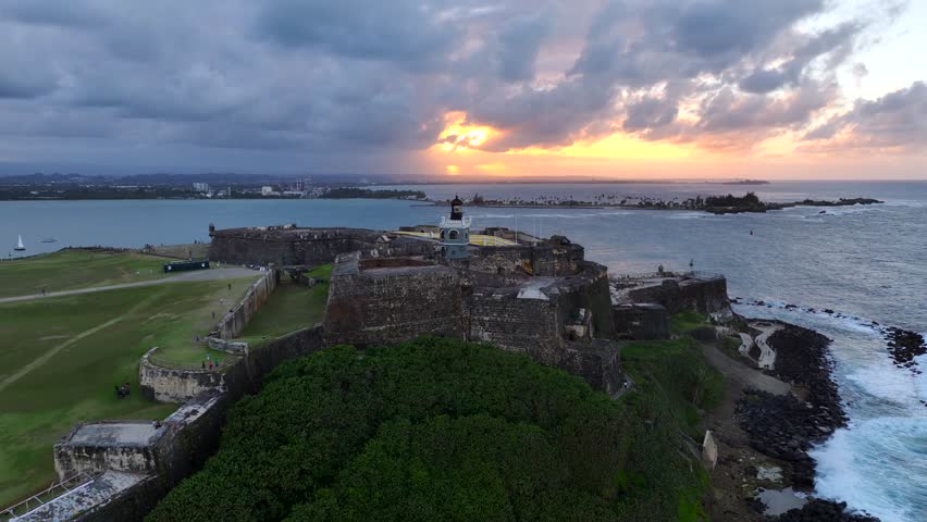 Old Fort San Juan in Puerto Rico at dusk - Aerial drone footage zooming out from old historic fortress built by the Spanish colonizers of the island