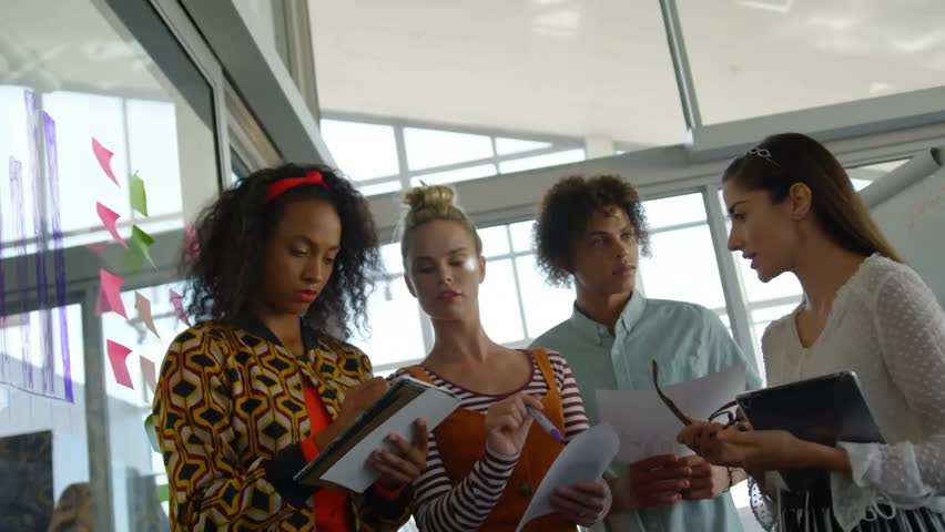 Animation of network of connections with icons over diverse business people in office. Global finance, business, connections, computing and data processing concept digitally generated video. - Powered by Shutterstock - Get 15% off with code: PIKWIZARD15