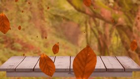 Animation of autumn leaves falling over trees and wooden surface. Autumn, fall and nature concept digitally generated video. - Powered by Shutterstock - Get 15% off with code: PIKWIZARD15
