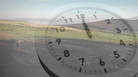 Animation of moving clock over landscape. Global business, time and digital interface concept digitally generated video. - Powered by Shutterstock - Get 15% off with code: PIKWIZARD15