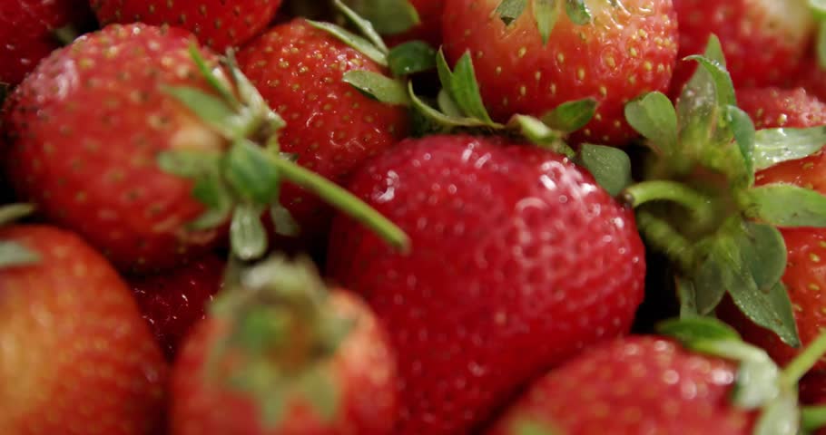 Animation of 100 percent home grown text over strawberries. Diet, healthy lifestyle and food concept digitally generated video.