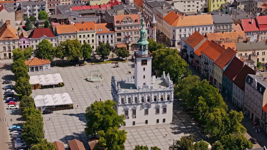Establishing shot of Chelmno Poland town hall square, historic architecture