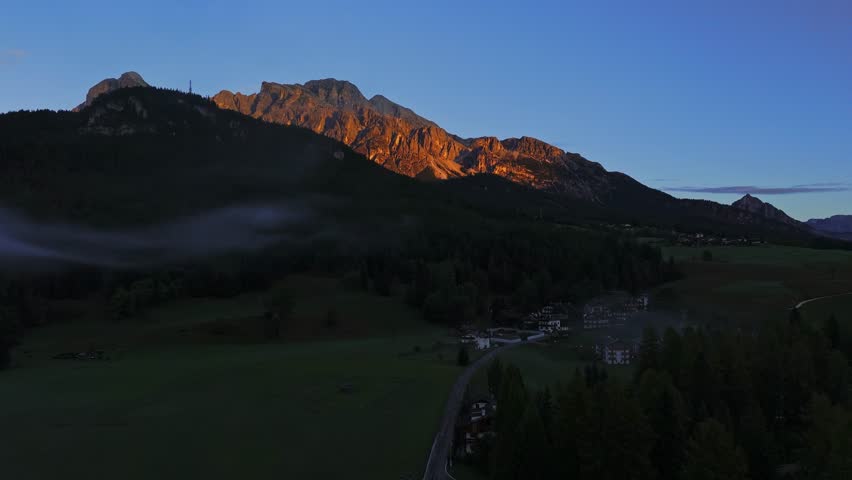 Early morning with fog among the high mountains in the Dolomites, Italy. Cortina d