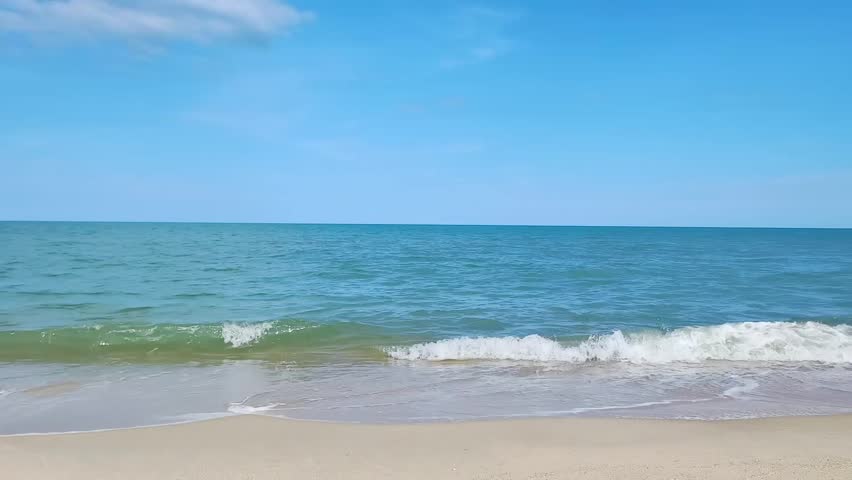 Seashore Serenity: The endless expanse of the ocean meets the tranquil sky, the rhythmic lapping of the waves against the shore providing a symphony of peace.