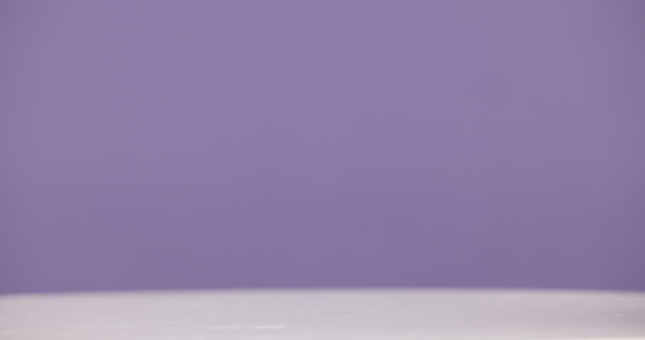 Bottle, product and advertising for skincare in studio, moisturizer and serum mockup on purple background. Beauty, container and marketing for cosmetic care, dermatology selection and presentation