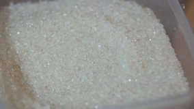 close up of stirring granulated sugar with a spoon - Powered by Shutterstock - Get 15% off with code: PIKWIZARD15