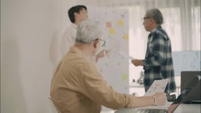 Asian professionals analyzing charts and financial data during a collaborative business strategy meeting in a modern office. - Powered by Shutterstock - Get 15% off with code: PIKWIZARD15