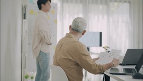 Asian professionals analyzing charts and financial data during a collaborative business strategy meeting in a modern office. - Powered by Shutterstock - Get 15% off with code: PIKWIZARD15