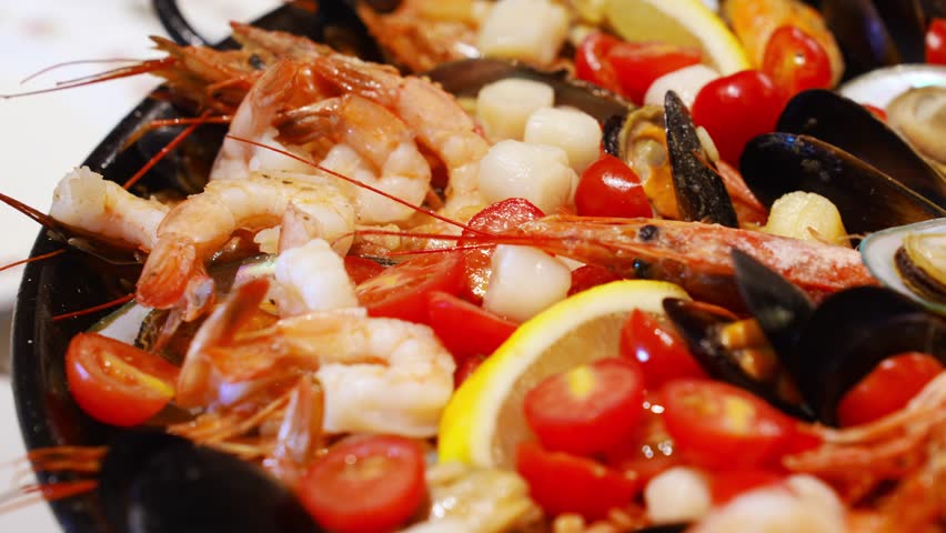 Delicious seafood platter prepared with fresh shrimp and mussels in Italy